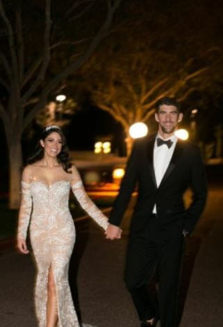 Debbie Phelps with her son Michael Phelps with his wife at their wedding reception.